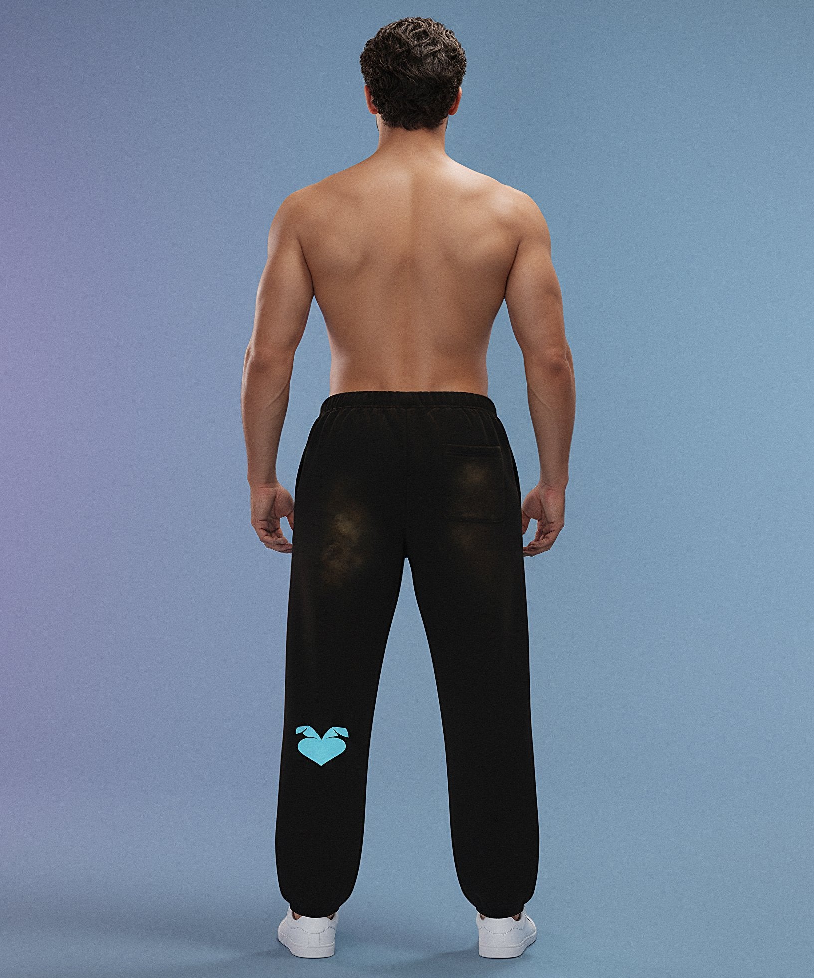 Black sweatpants with sweethearts 'Baby!' text on a gray background, male back view