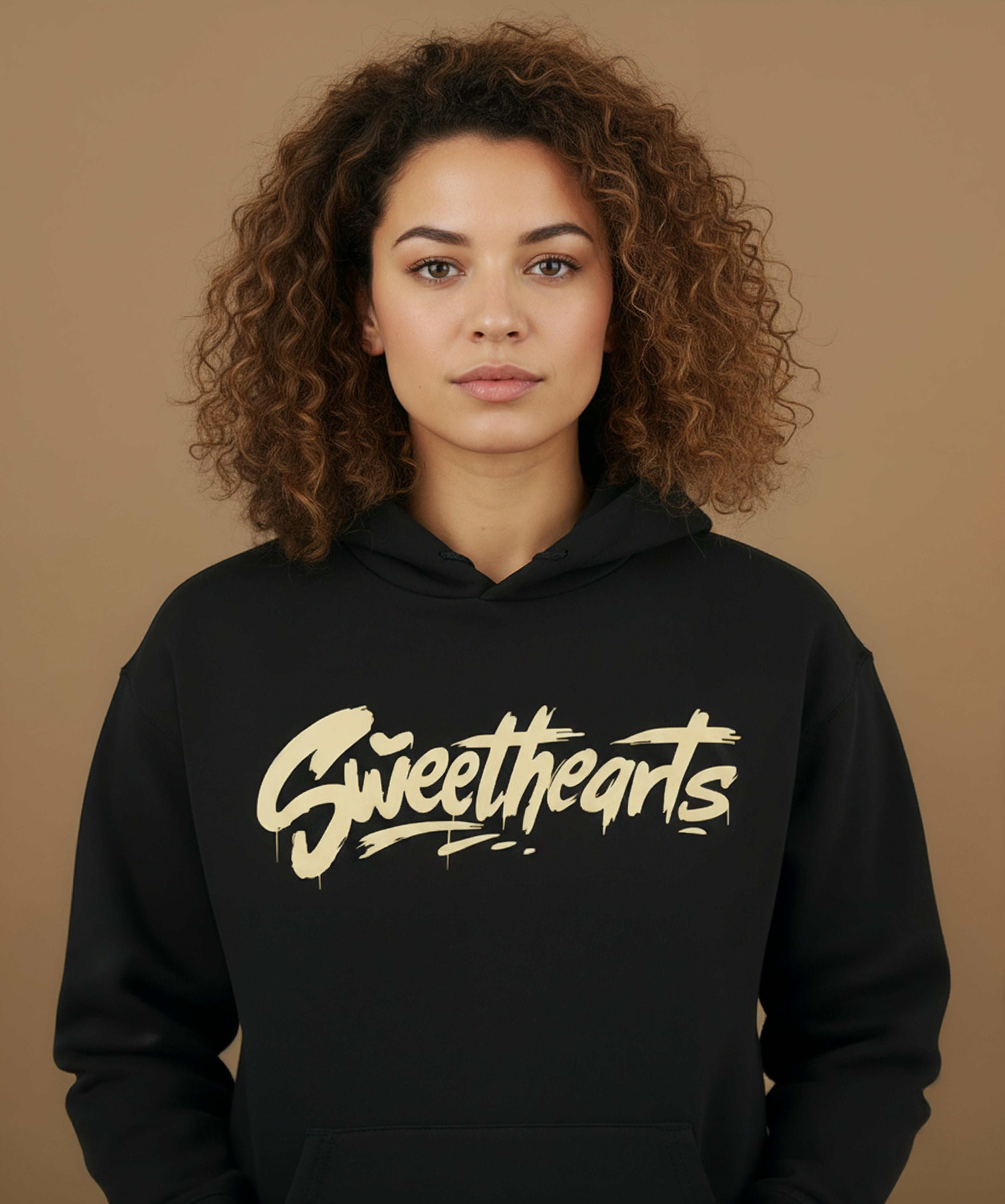 Front view of Sweethearts graffiti text hoodie in black on female model