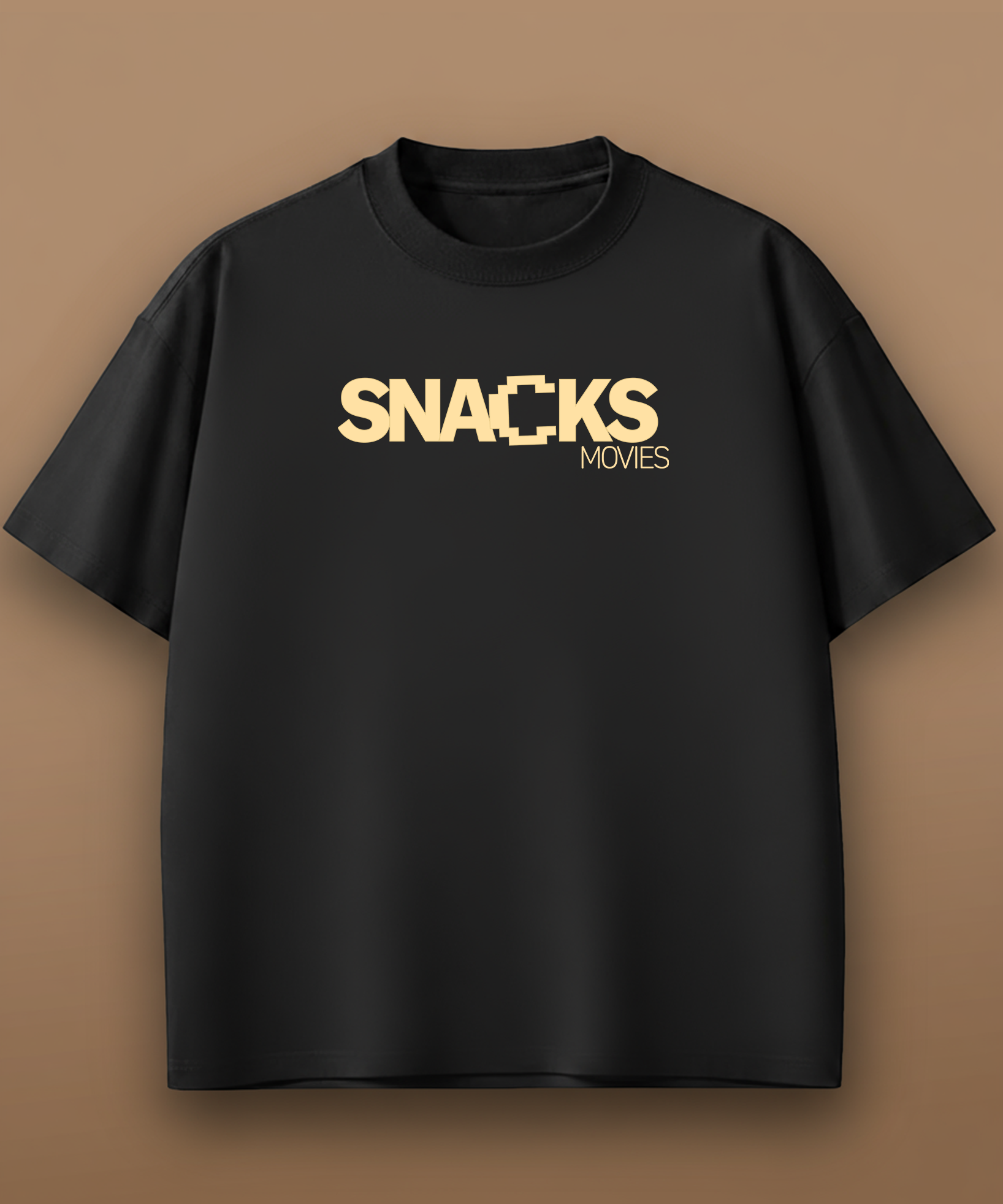 Black t-shirt with 'SNACKS MOVIES' text in gold on a brown background, front graphic