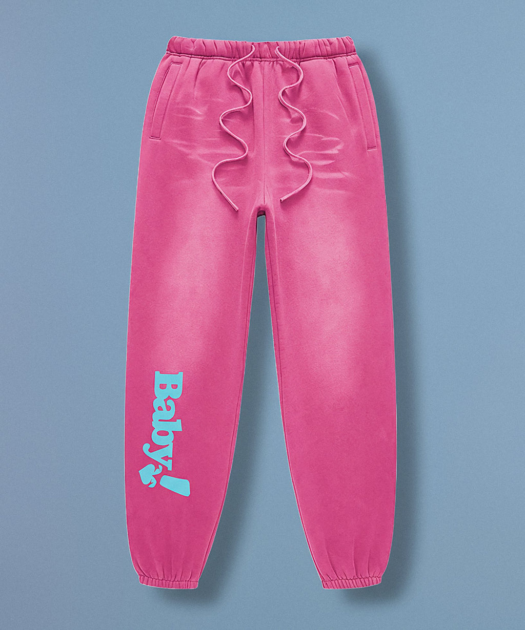 Pink sweatpants with sweethearts  'Baby!' text on a blue background