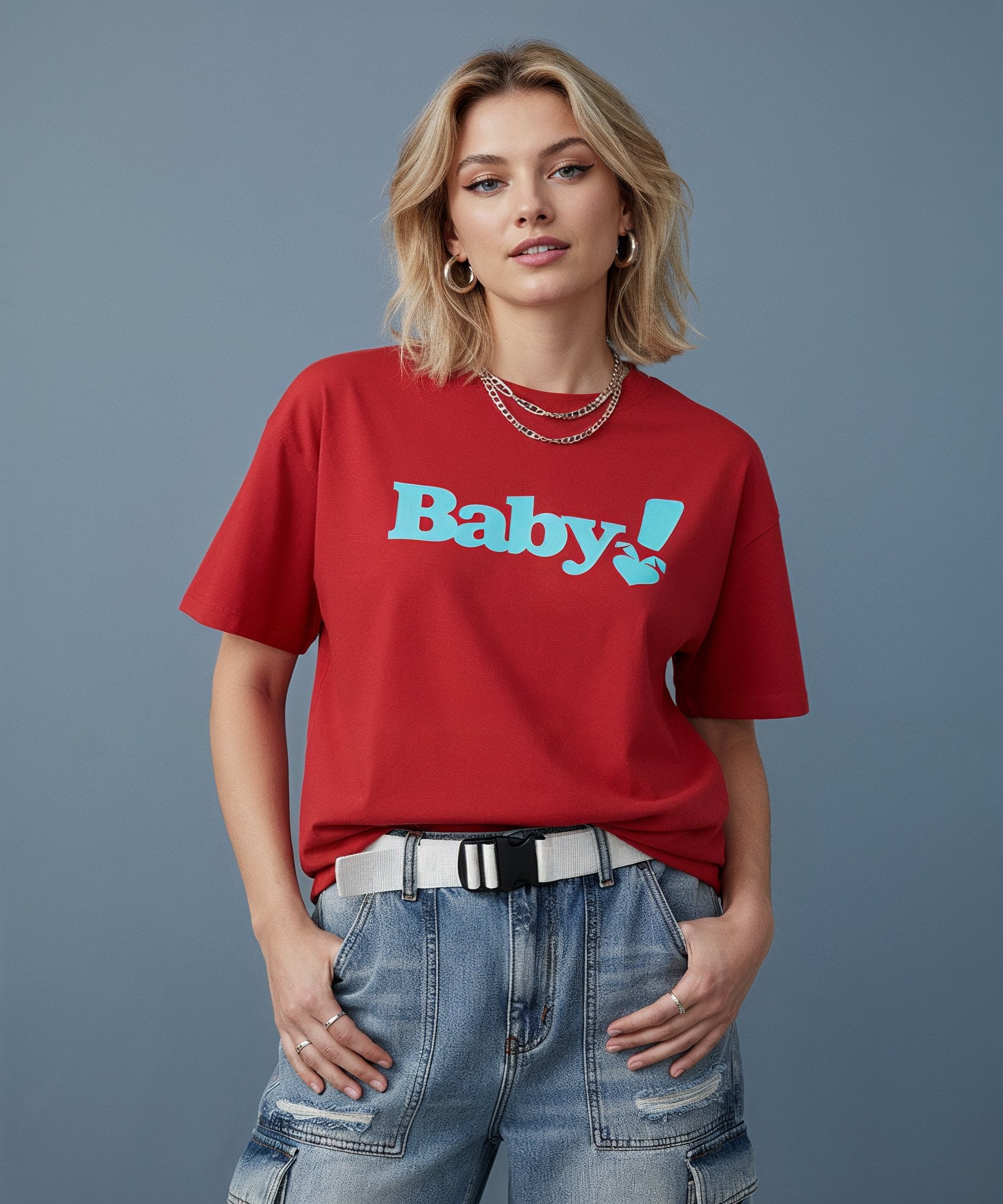 Woman wearing a red t-shirt with 'Baby!' text on a blue background