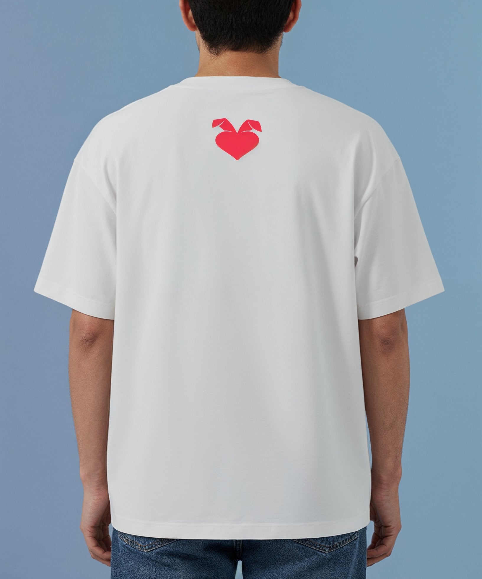 male wearing a white t-shirt with a red sweethearts logo heart design on the back against a blue background