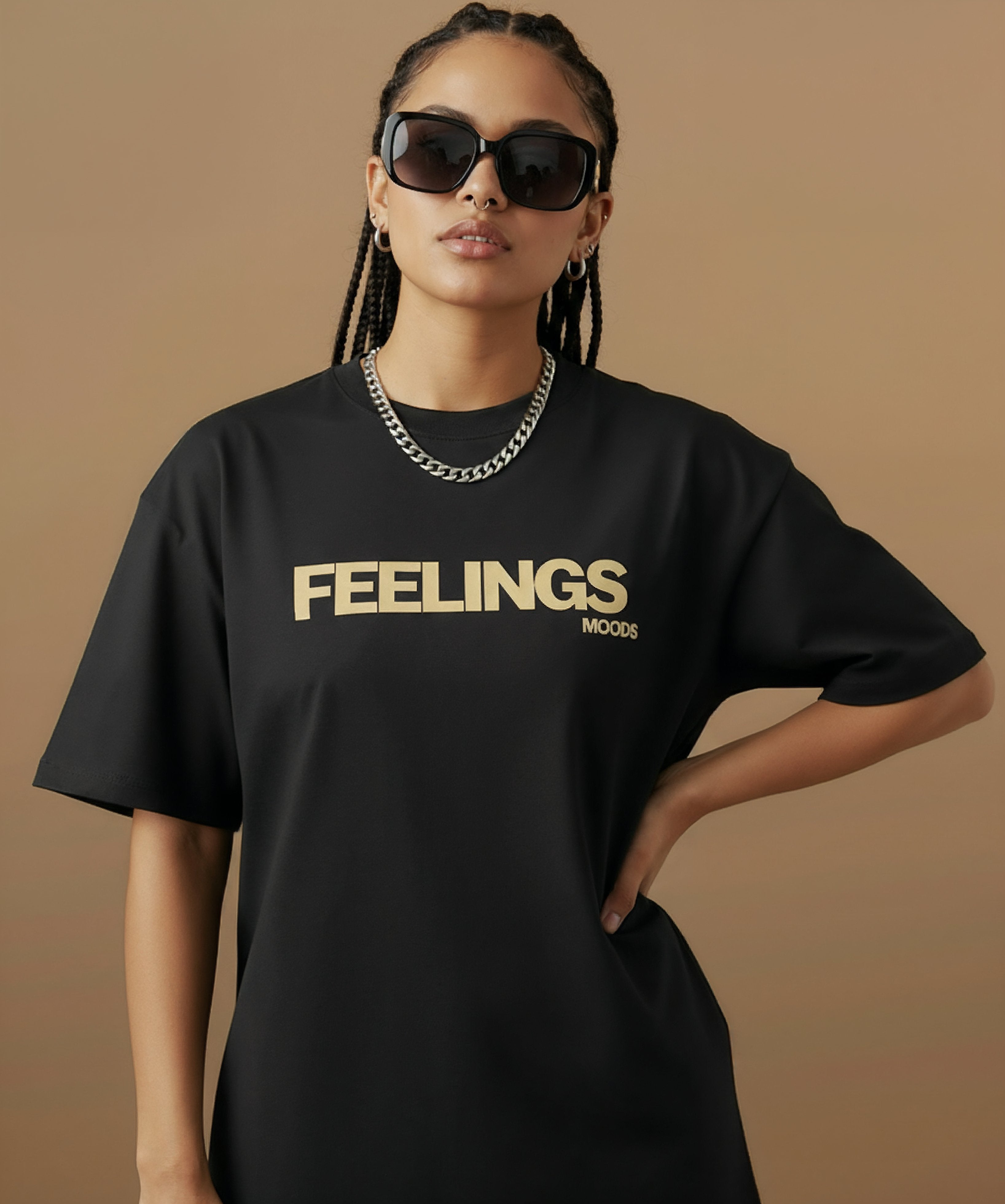 female model wearing a black t-shirt with  sweethearts brand 'FEELINGS MOODS' text on a brown background. centered forward