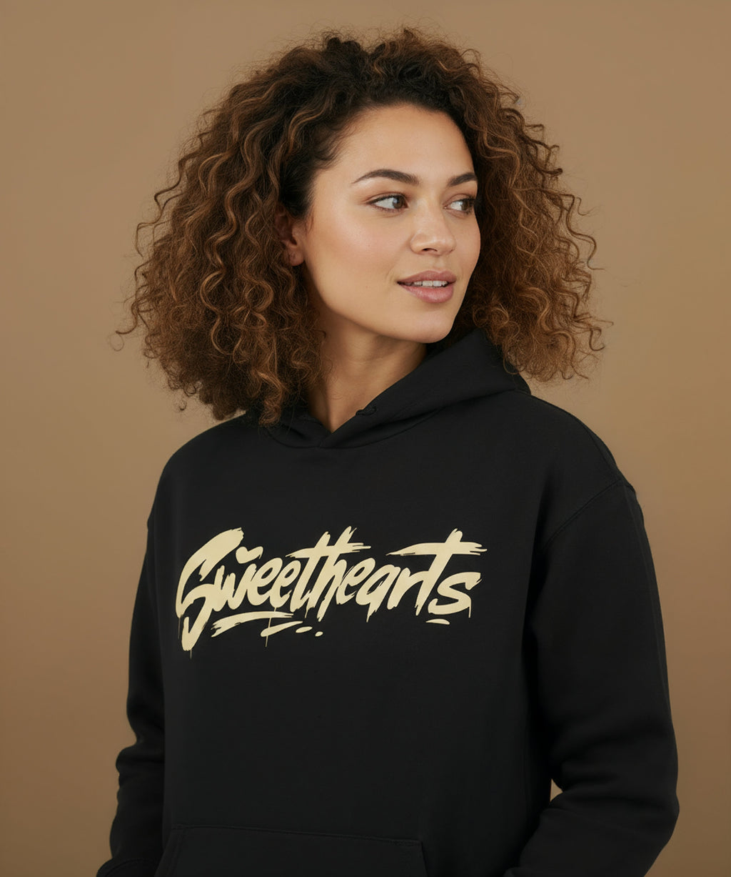 side view of Sweethearts graffiti text hoodie in black on female model