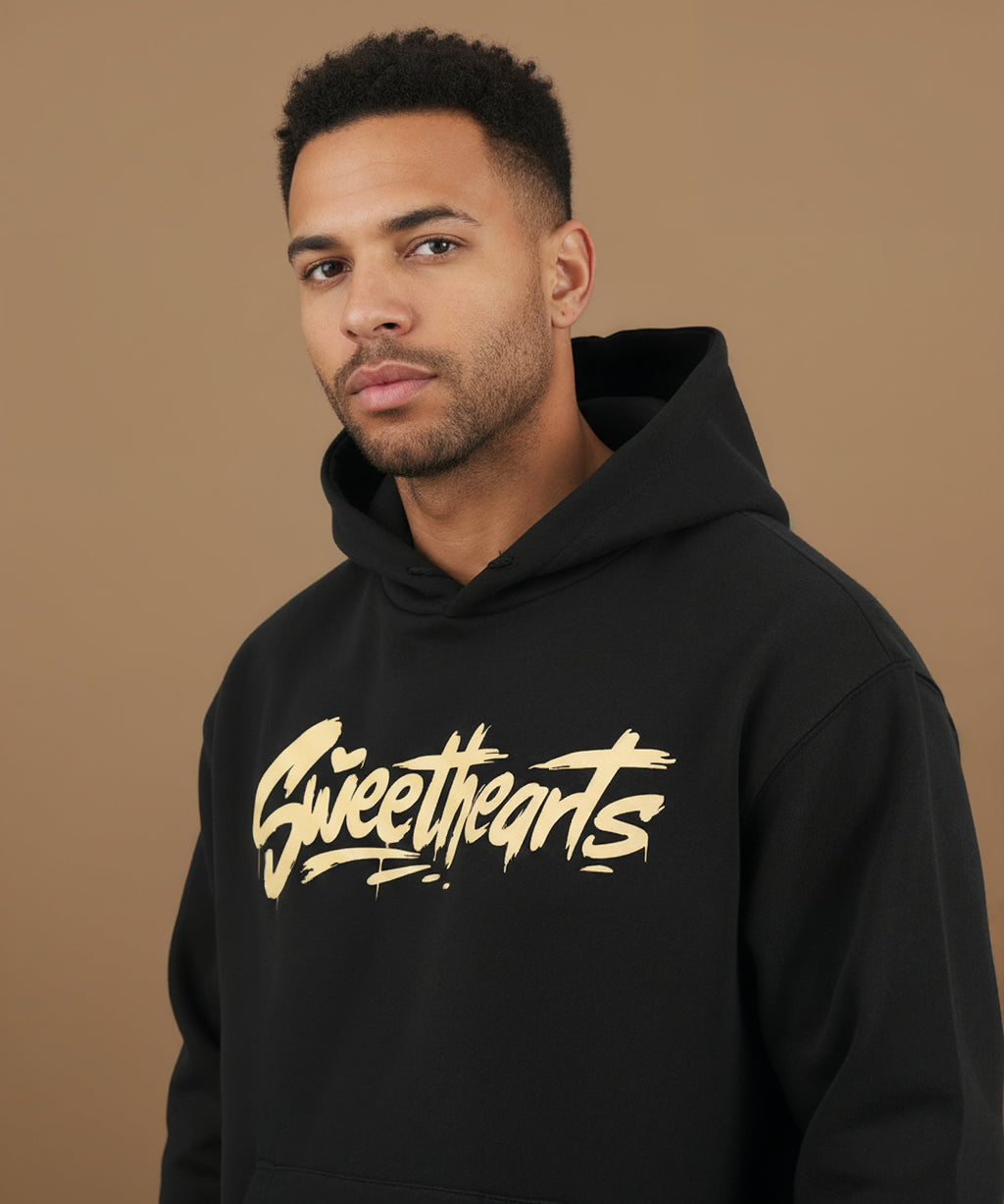left view of Sweethearts graffiti text hoodie in black on male model