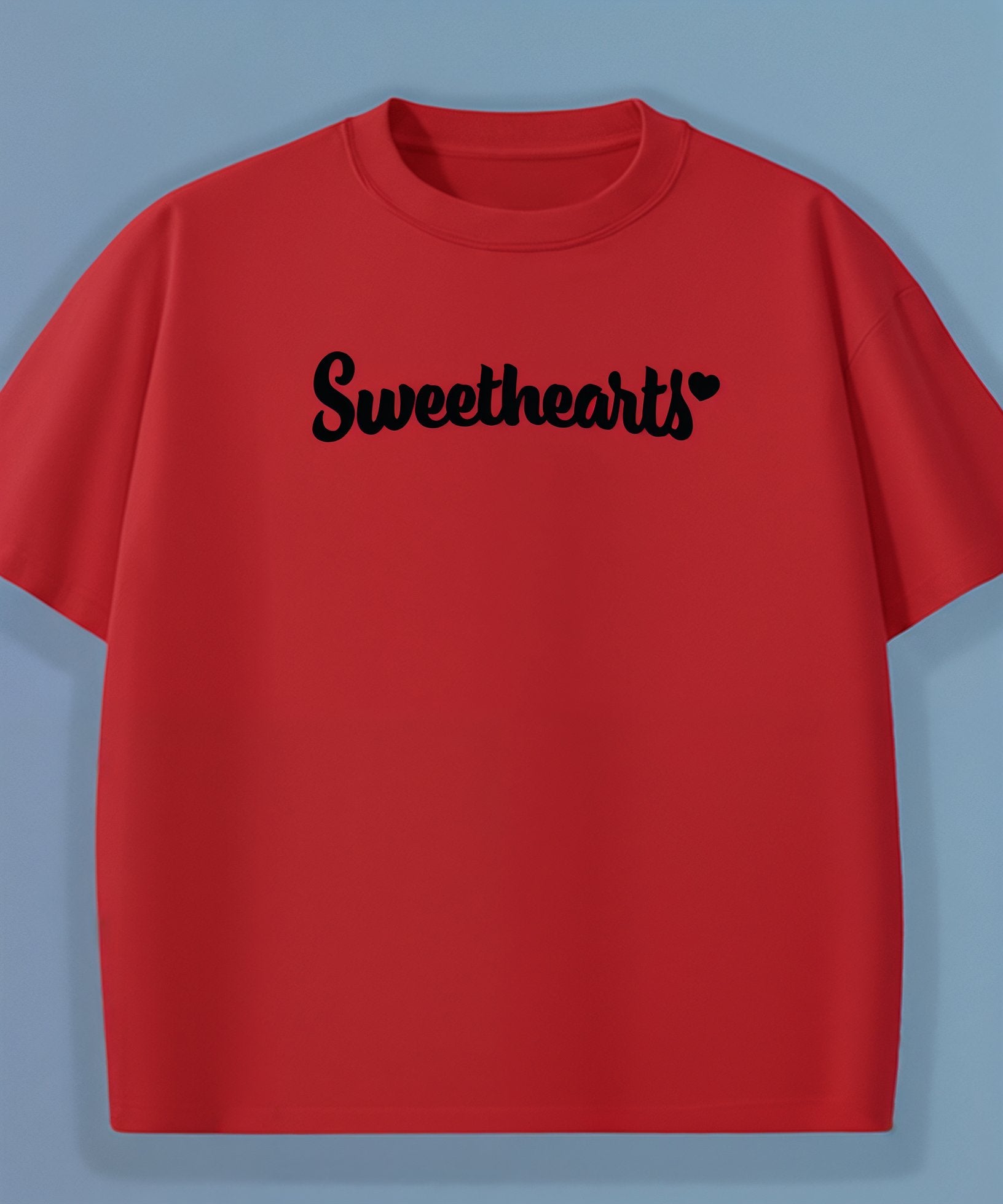Red t-shirt with 'Sweethearts' text on a light blue background