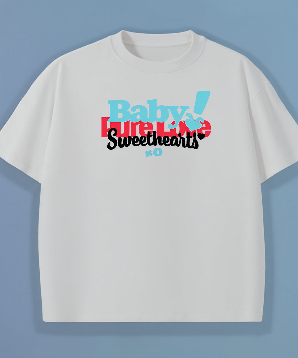 White t-shirt with colorful text design on a blue background, pure love