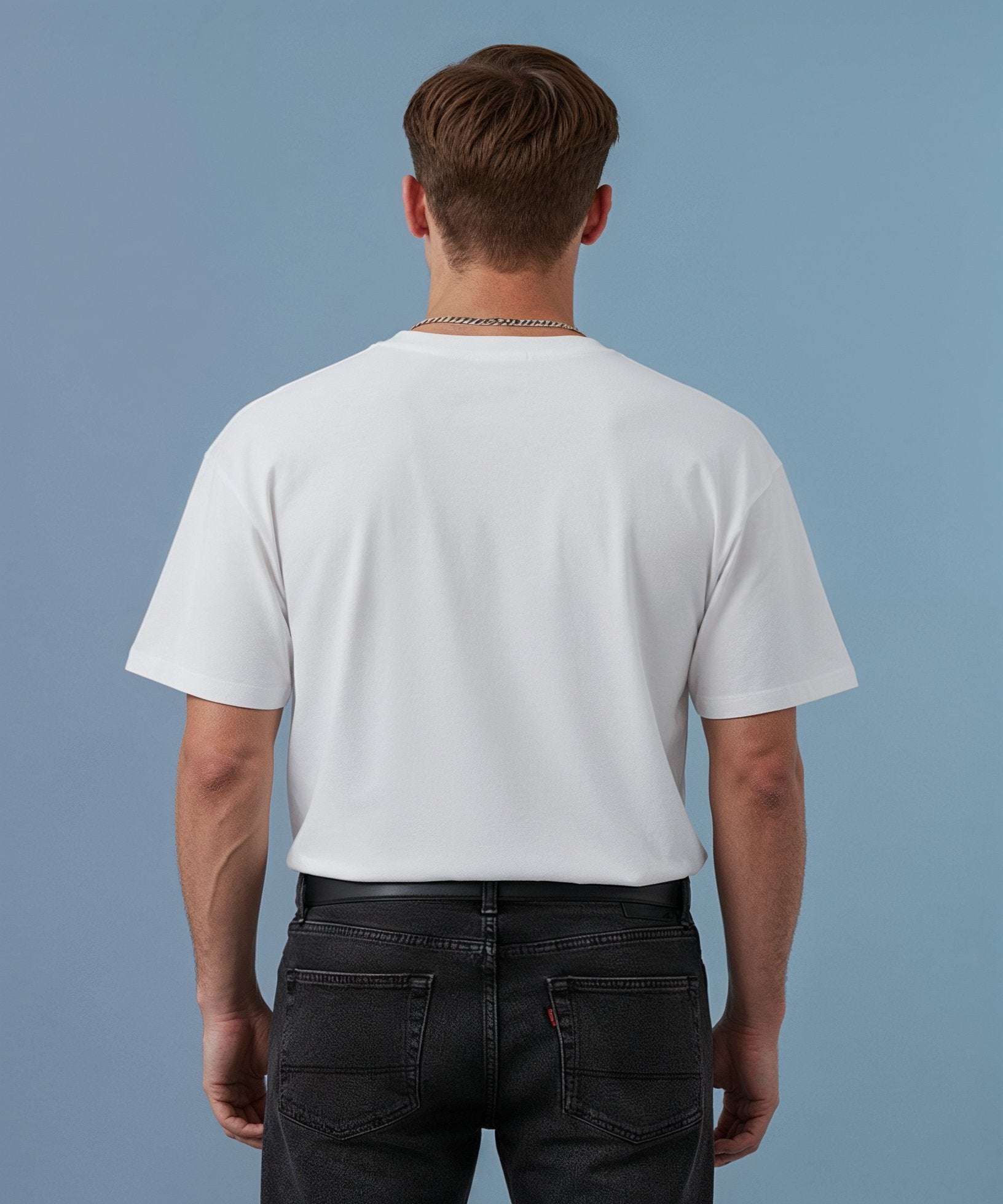 male wearing a white sweethearts t-shirt called pure love, against a blue background, back view