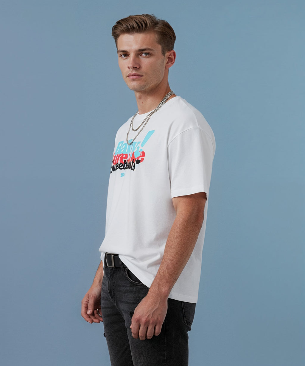 male wearing a white sweethearts t-shirt called pure love, against a blue background, side view
