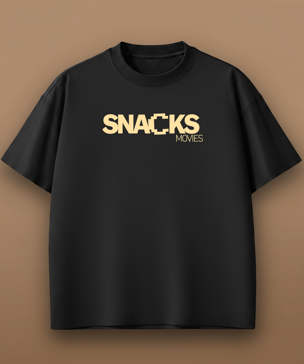 Black t-shirt with 'SNACKS MOVIES' text in gold on a brown background, front graphic