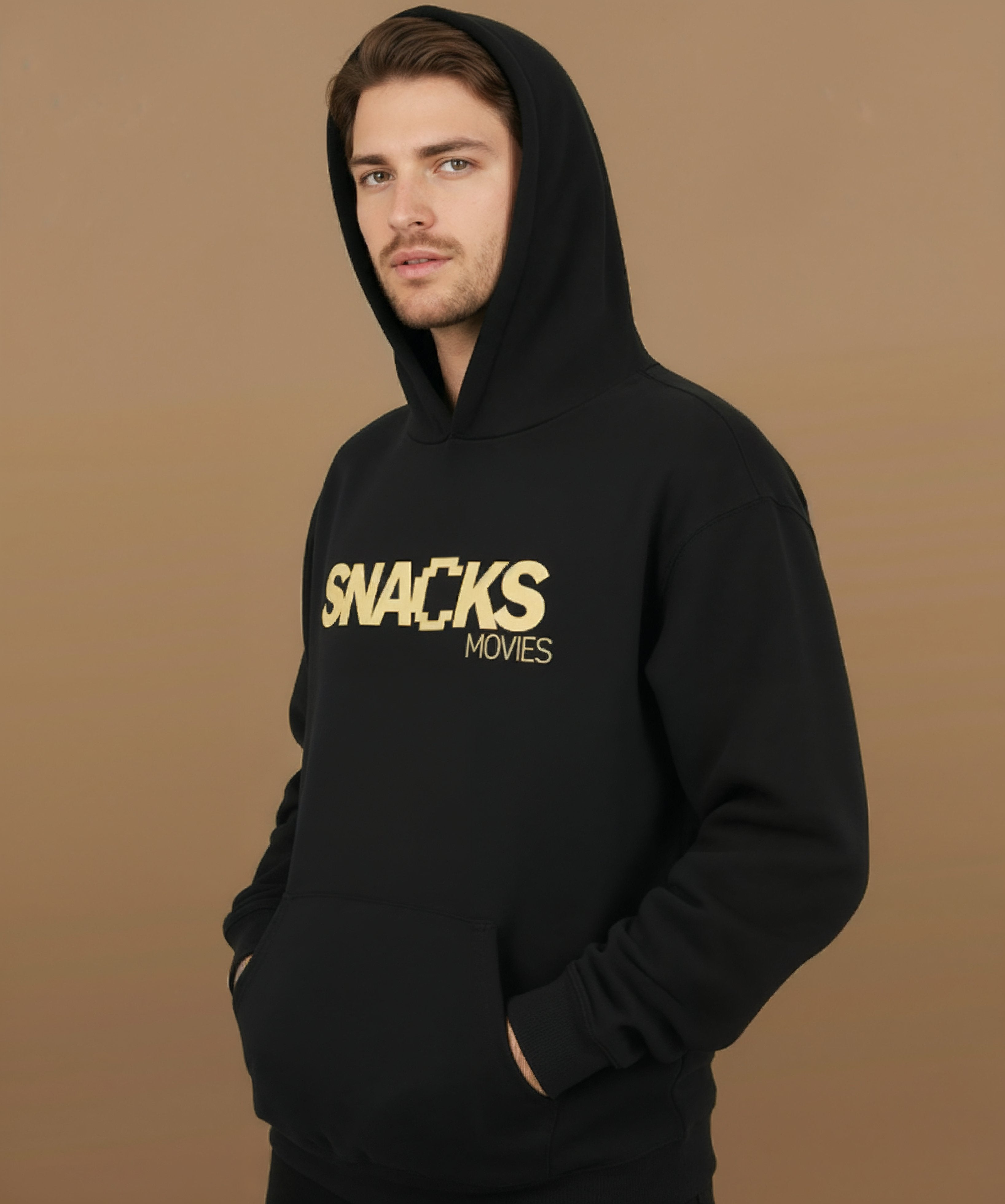 male model wearing Sweethearts Snacks & Movies hoodie from the Moods Drop collection, left angle