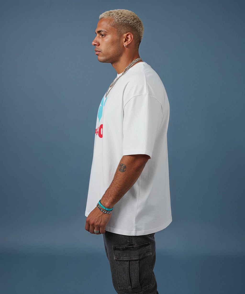 male wearing a white t-shirt with the sweethearts hearts and hugs logo  graphic design on a gray background, side view