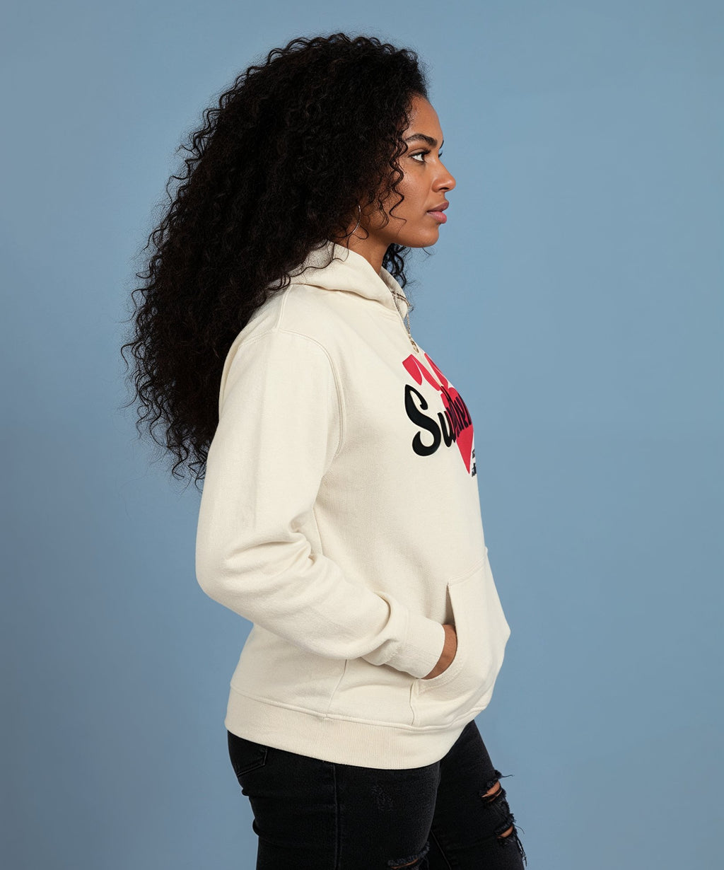 Person wearing a white hoodie with a logo on a blue background