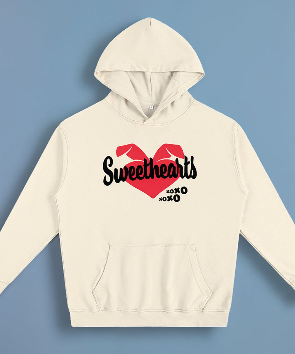 cream hoodie with 'Sweethearts' design on a blue background