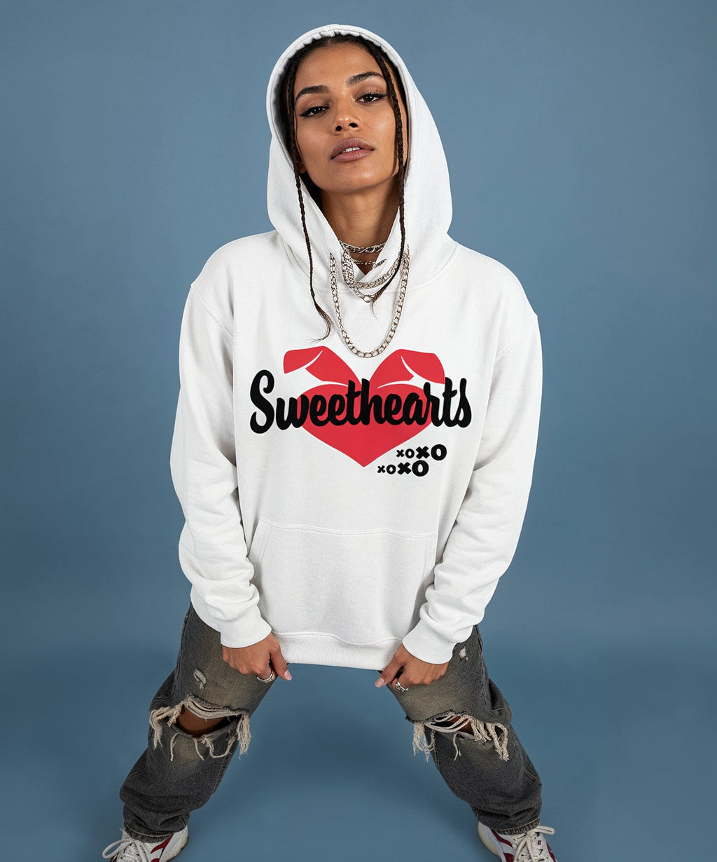 female wearing a white hoodie with a sweethearts red heart logo and xoxo design and text on a blue background