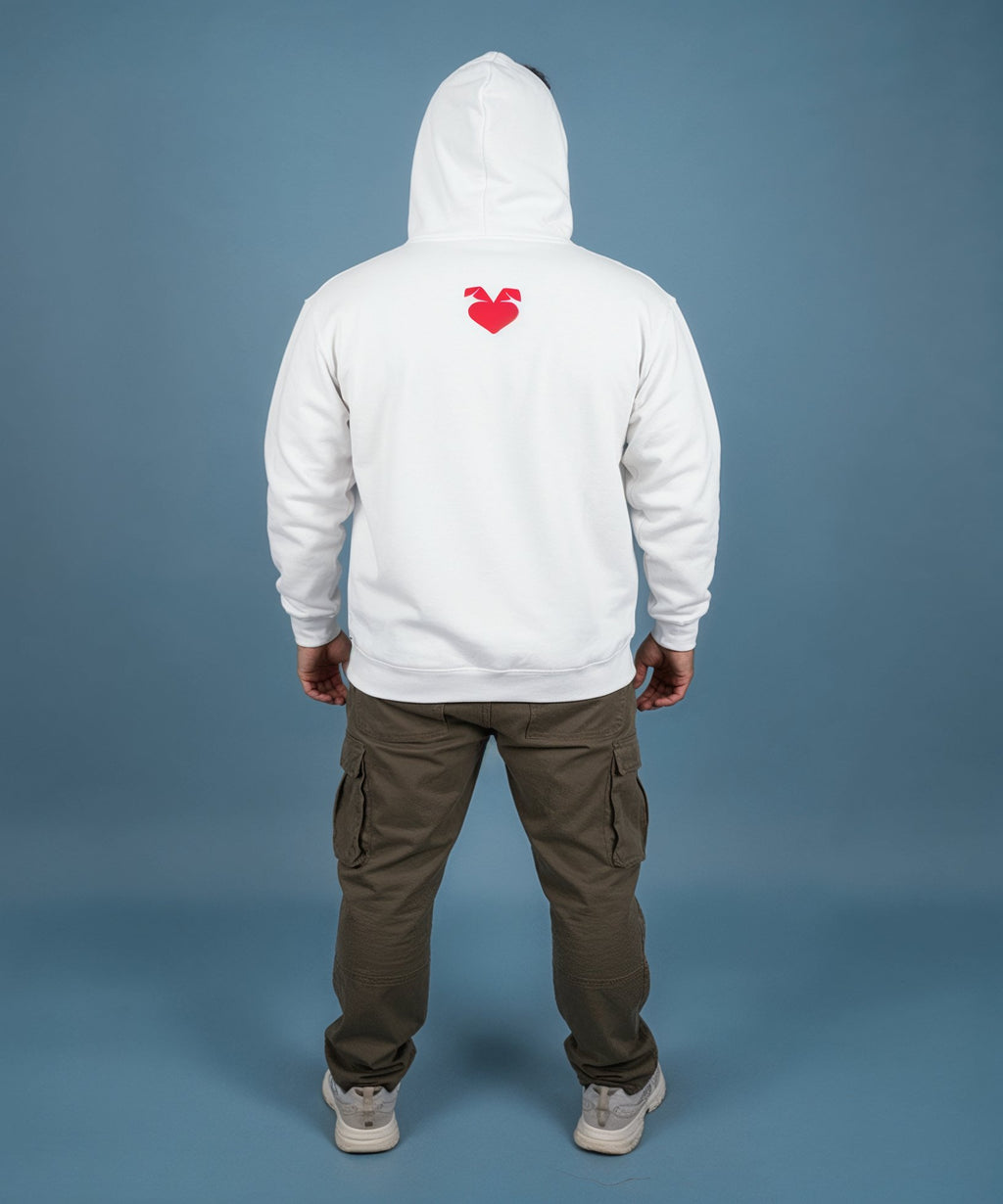 Man wearing a white hoodie with a sweethearts red heart logo and xoxo design and text on a blue background, back view